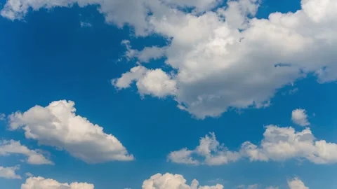 Timelapse of white fluffy clouds slowly floating in blue sky 스톡 동영상 337872859