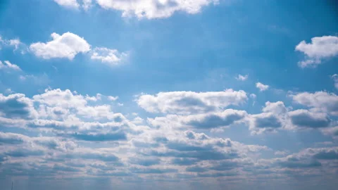 Timelapse White Fluffy Olakas Float Through the Blue Sky on a Sunny Day Stock Footage 187526705