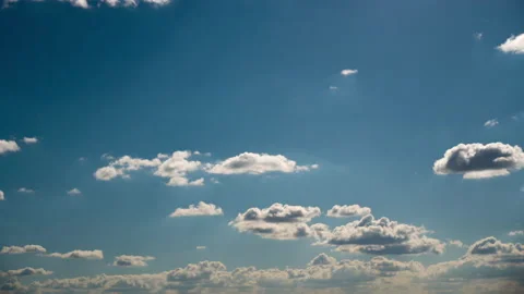 Timelapse White Fluffy Olakas Float Through the Blue Sky on a Sunny Day Stock Footage 188046995