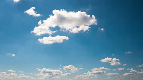 Timelapse White Fluffy Olakas Float Through the Blue Sky on a Sunny Day Stock Footage 190980895