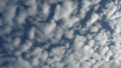 Timelapse of white summer clouds drifting through blue summer sky Stock Footage 311285289