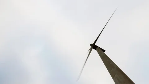 Timelapse of Wind Turbine with moving clouds above 動画素材 100851141