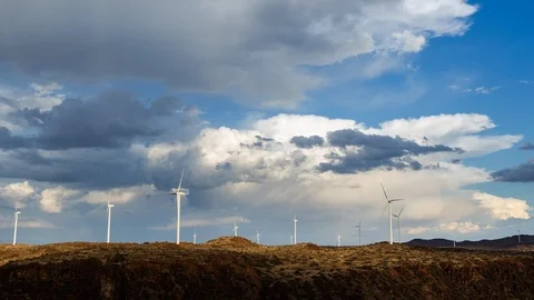 Timelapse of wind turbines in an open field Stock Footage 101682432