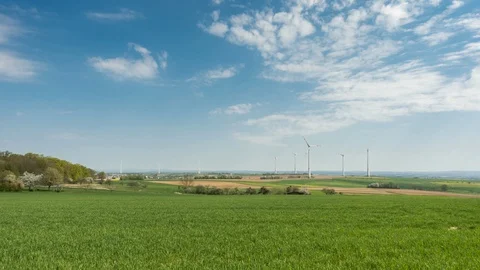 Timelapse - Wind Turbines under a partly cloudy sky Видео 129077180