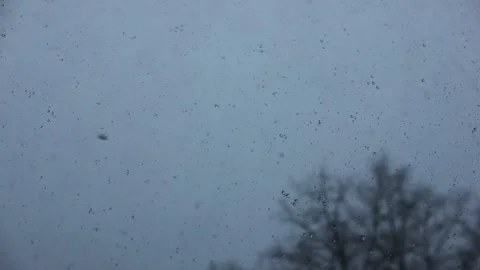 Timelapse window glass closeup during sudden snowstorm Stock Footage 123360346
