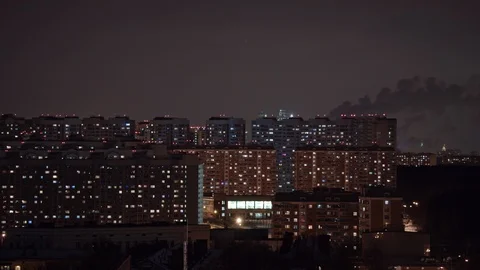 Timelapse of window lights and smoking pipes in city at night. Moscow, Russia 動画素材 88994207