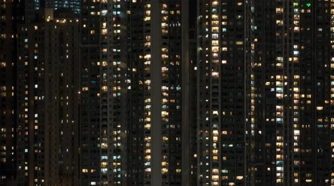 Timelapse of window lights in high-rise apartment block at night Stock Footage 68858136