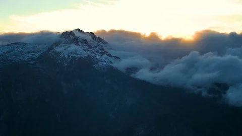 Timelapse of winter sunset in high snowy mountains with clouds Stock Footage 70698182