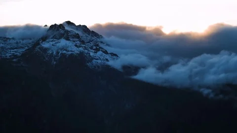 Timelapse of winter sunset in high snowy mountains with clouds Stock Footage 71208746