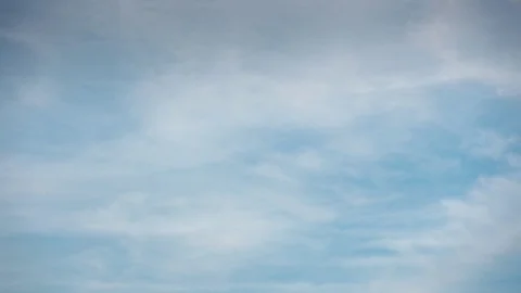 Timelapse wispy cirrus clouds move against blue sky England April 2017 Stock Footage 81914527