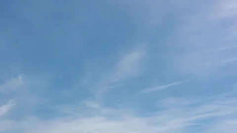 Timelapse of Wispy White Clouds in Blue Tuscan Sky in 4K Stock Footage 335493835