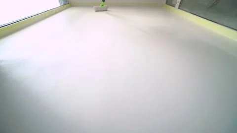 Timelapse of Worker Painter Paints the Wall with a Roller in Light tones Stock Footage 125714351