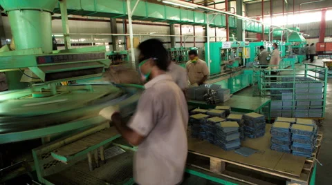 Timelapse of Workers at an Industrial Machine in a Factory Stock Footage 60955331