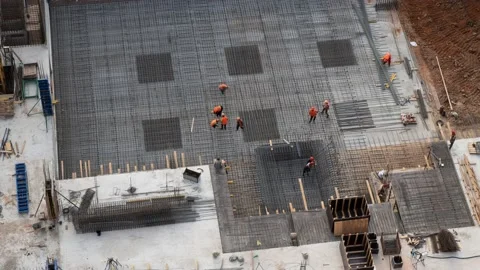 Timelapse of workers making metal reinforcements for concrete base Stock Footage 219093952