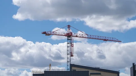 Timelapse with working construction cranes building houses on sky background. Video stock 138148860