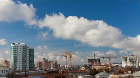 Timelapse working construction cranes on a clear day with flying clouds Stock Footage 52338626