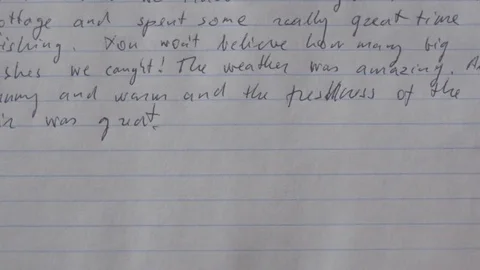 Timelapse of writing with a pen on lined sheet of paper Stock Footage 75564814