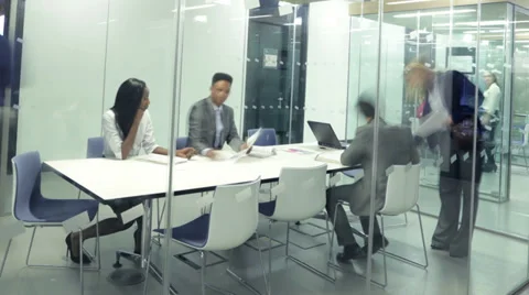 Timelapse of young attractive business group in a meeting in modern city office Stock Footage