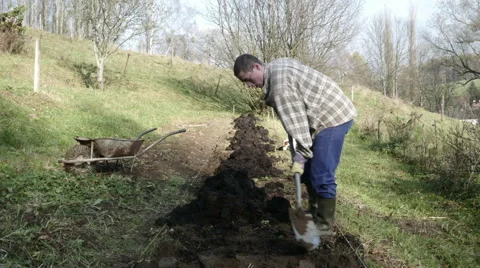 Timelapse of Young Gardener working in the garden with spade Video stock 44228217