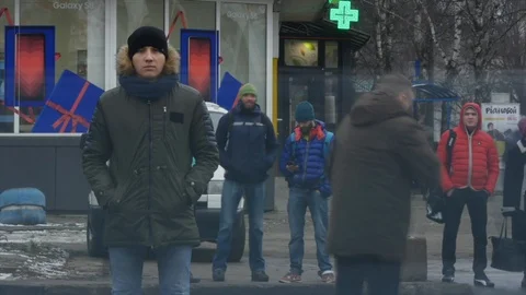 Timelapse of Young man standing still at sidewalk in crowd traffic stream with Stock Footage 89831697