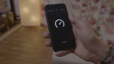 Timelapse of young man testing his home internet bandwidth using speed test a Stock Footage 102799534