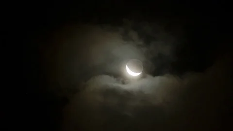 Timelapse of young moon mooving through clouds at night Stock Footage 81611415