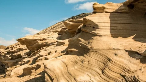 Timelapse zoom of a deeply indented coastline with rising clouds and shadows Video stock 72363300