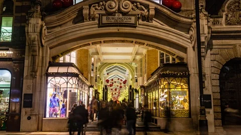 Timelapse zoom in view of an arcade with Christmas decorations in London Stock Footage 100984128