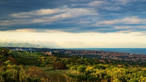 Timelapse zoom in view of a sunset on the town of Acireale in Sicily Stock Footage 108731330
