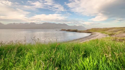 Timelapse/Hyperlapse of clouds over mountainous ocean inlet Video stock 310645897