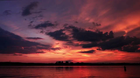Timelapsel Sunset under the River. Red Sun Reflected in Water Stock Footage 63032584