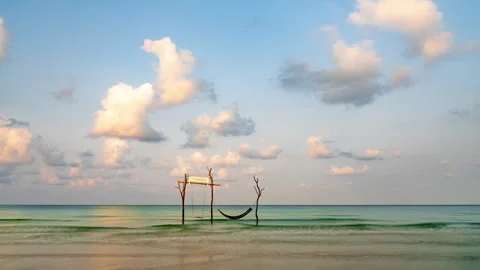 Timelaspe of beautiful moving clouds and ocean waves during morning sunrise Stock Footage 272614574
