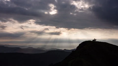 Timelaspe - Sunlight pillars through clouds 4K60 Stock Footage 269125363