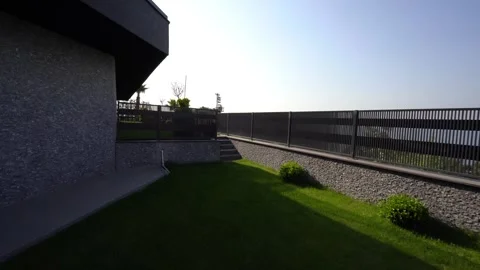 Timeless Backyard Bliss-Lush Greenery Structure Stock Footage 308996478