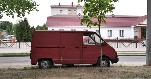 Timeless Charm: A Weathered Red Van with a Story to Tell Stock Footage 242805093