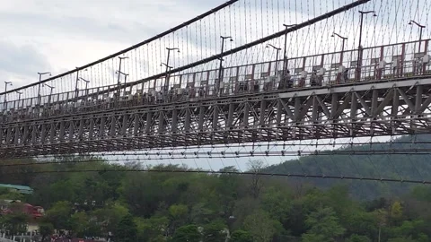 Timeless Crossing: Rishikesh Bridges Connecting Faith and Nature Stock Footage 313564503