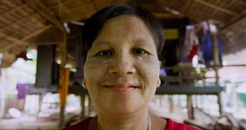 Timeless portrait of a real unique authentic Asian woman in Myanmar. Hand held, Video stock 201094056