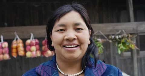 Timeless portrait of a real unique authentic Asian Myanmar shop trader woman in Vídeos de archivo 201094456