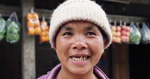 Timeless portrait of a real unique authentic Asian Myanmar shop trader woman in Stock Footage 201094782