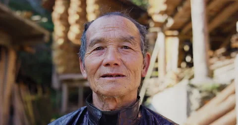 Timeless portrait of a real unique authentic Asian Chinese village man, rice far Видео 201095334