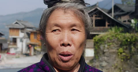 Timeless portrait of a real unique authentic Asian Chinese village woman of Tung Stock Footage 201095827