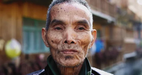 Timeless portrait of a real unique authentic Asian Chinese village man, rice far Video stock 201096615