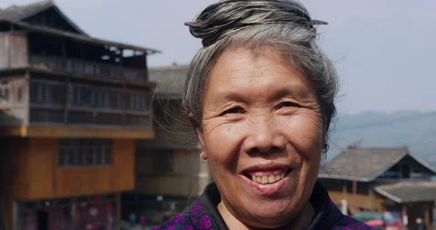 Timeless portrait of a real unique authentic Asian Chinese village woman of Tung Stock Footage 201096779