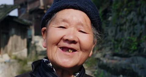 Timeless portrait of a real unique authentic Asian Chinese village woman of Tung Stock Footage 201097043