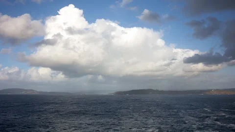 Timeless Tides: A Time-lapse of Clouds Over Coastal Shores Stock Footage 265782489