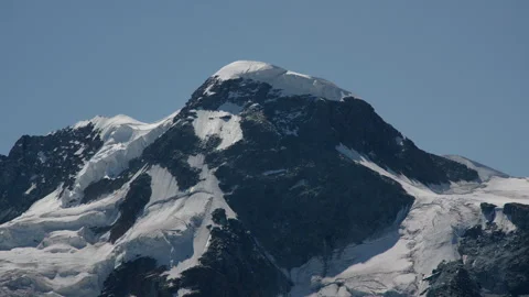 Timeless view of Breithorn beneath a bright alpine summer sky Stock Footage 341870991