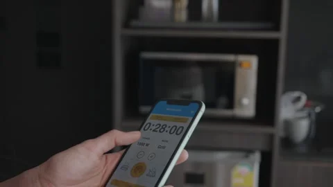 Timer App on Smartphone in Modern Kitchen Setting Stock Footage 314570400