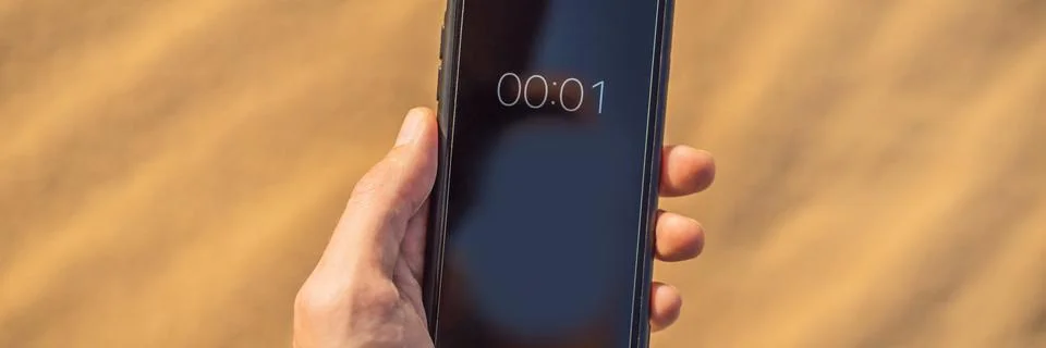 A timer with a countdown to climate change. Desert timer. Global warming concept Stock Photos