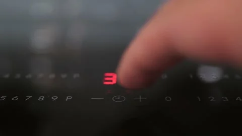 Timer setting on ceramic cooktop. 4K footage Stock Footage 141072187