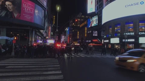 Times Square- 42nd St &amp; 7th Ave- Pan Right Reveals Cars Moving South on 7th Ave Stock Footage 101308483